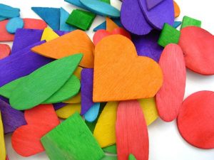 colored wooden shapes with hearts