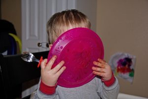 child licking plate