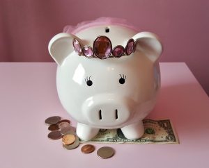 a cute piggy bank with coins