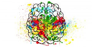 brain with paint splashes representing activity