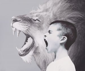 boy and lion roaring